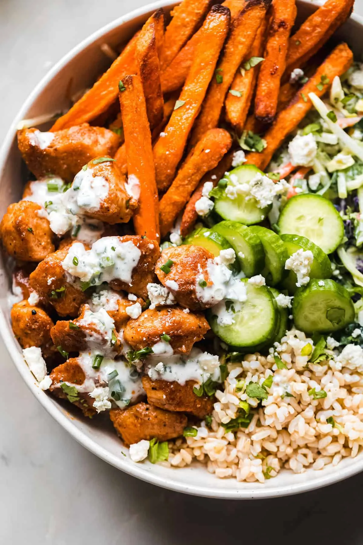 Delicious Buffalo Chicken Bowls with Sweet Potato Fries