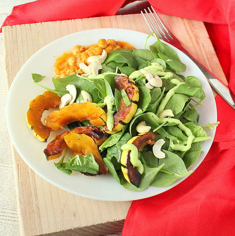 Maple Glazed Delicata Squash, Cashews, Baby Spinach Salad With Creamy Wasabi Dressing.