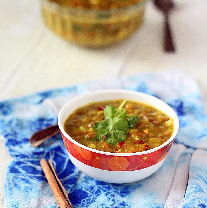 Whole Red lentil and Mung bean Daal stew with shallots and tomatoes.
